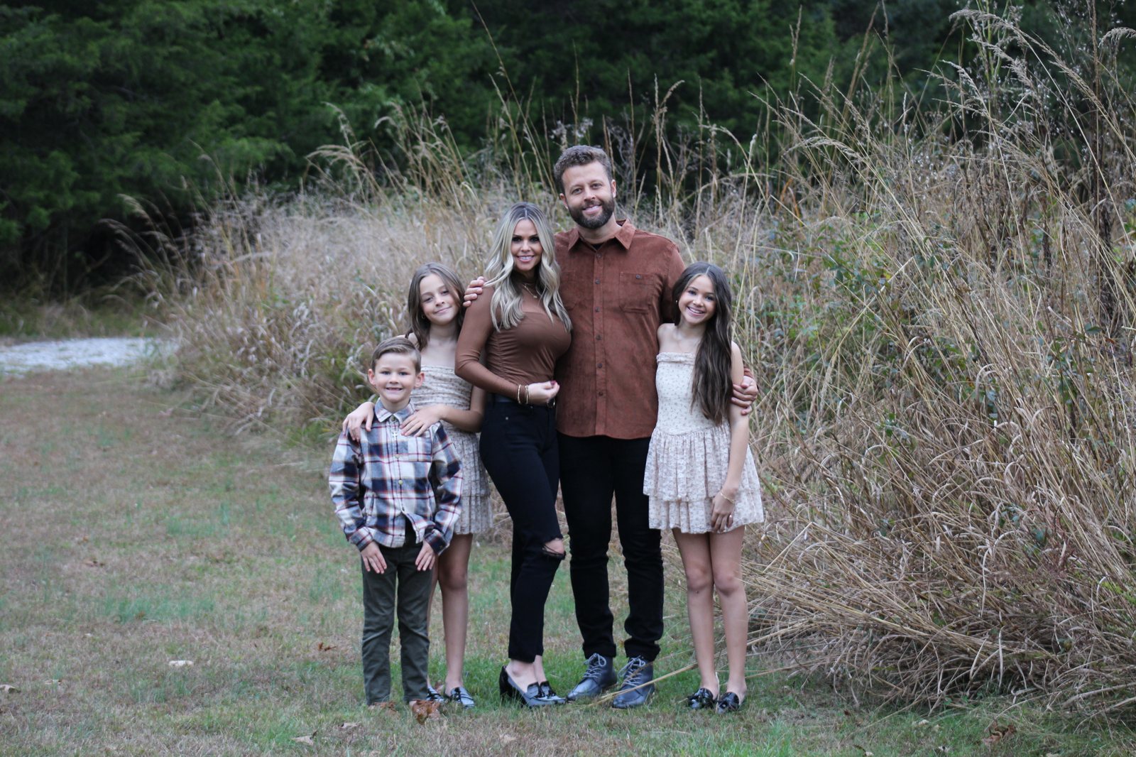 Luke and Shawnee, owners of Cool Springs Painting, with their family